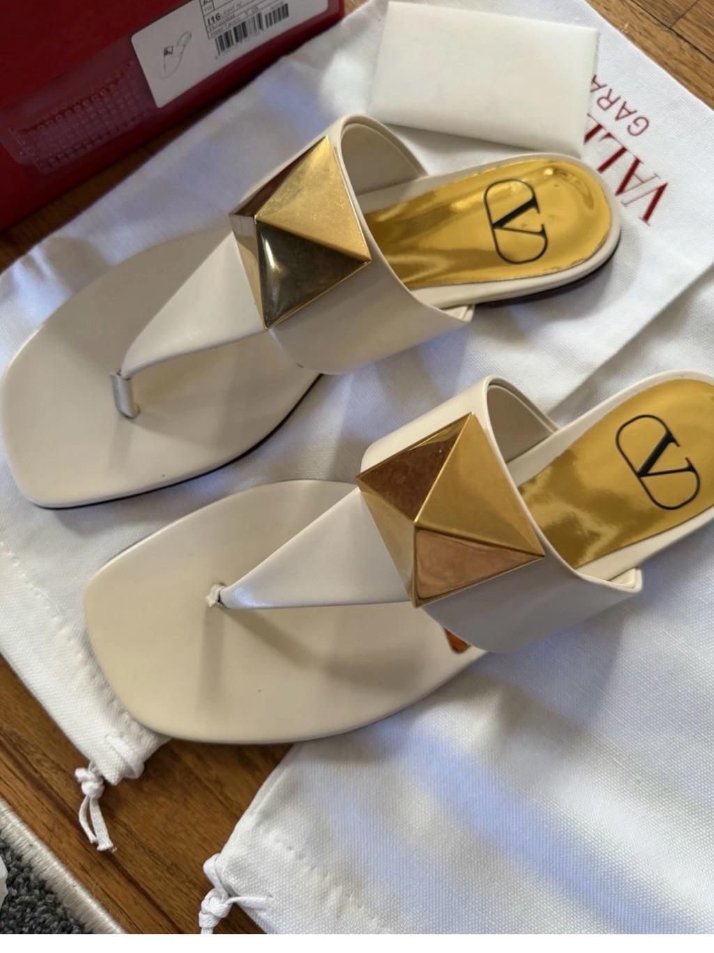 Valentino Garavani Ivory Leather Thong Sandals With Gold Pyramid Accent